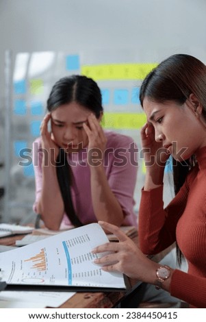 A team of female office workers is stressed over finding solutions to problems in meeting documents. The head of the organization blames the work for being unsuccessful. Discussion concept improvement