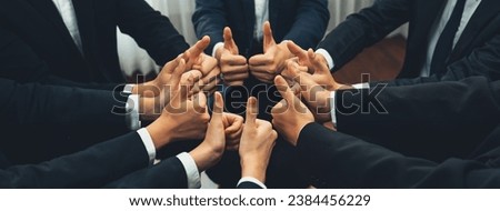 Office worker team stacking hand together symbolize successful group of business partnership and strong collective unity teamwork in community workplace in panoramic banner. Shrewd Royalty-Free Stock Photo #2384456229