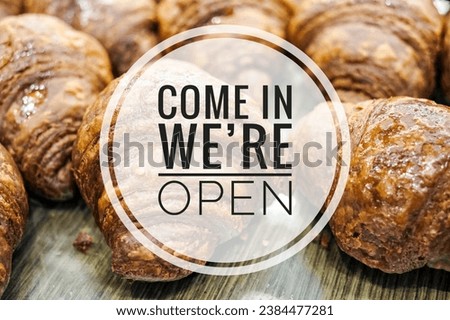 "COME IN WE'RE OPEN" word concept on background