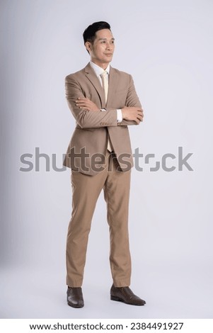 fullbody of a successful businessman posing on a white background Royalty-Free Stock Photo #2384491927