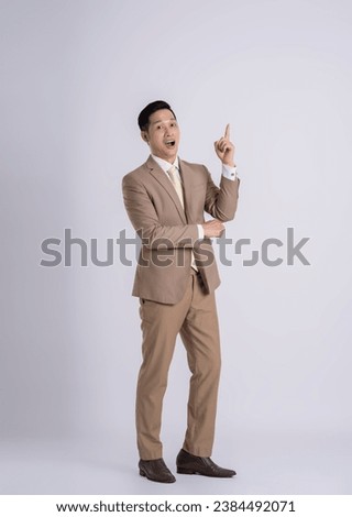 fullbody of a successful businessman posing on a white background Royalty-Free Stock Photo #2384492071