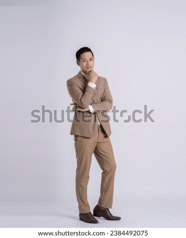fullbody of a successful businessman posing on a white background Royalty-Free Stock Photo #2384492075