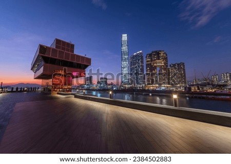 Promenade of Victoria harbor of Hong Kong city at dusk Royalty-Free Stock Photo #2384502883