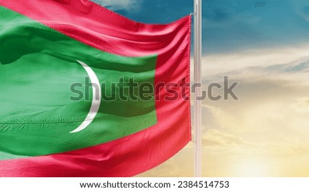 Maldives national flag waving in beautiful sky. The flag waving with dynamic angle.
