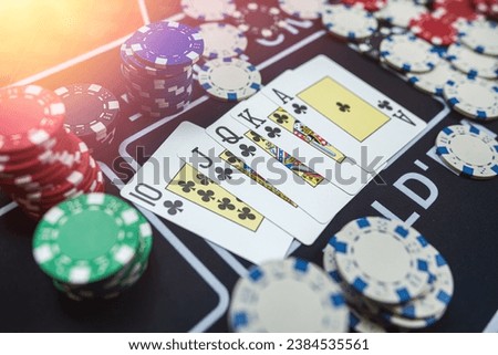 winning combination of playing cards and chips in poker club. Poker game, lifestyle Royalty-Free Stock Photo #2384535561