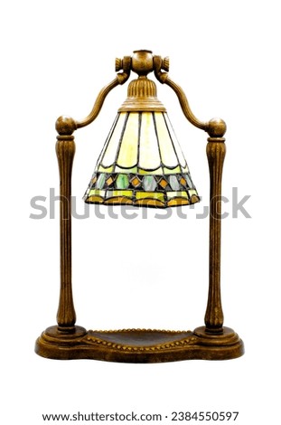 Tiffany style vintage accent bell shape wishbone harp lamp design with attached stained glass in green, yellow, red colors. Adjustable head. Isolated on white background. November 2023, Florida Royalty-Free Stock Photo #2384550597