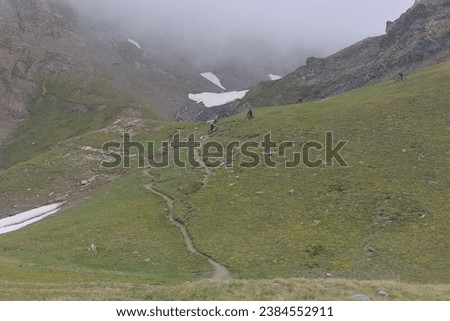 
Cyclists with e-bikes on the Nivolet hill, Gran Paradiso Park