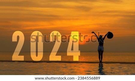 Happy new year card 2024. Silhouette lifestyle woman yoga raise arm standing as part of Number 2024 near the beach at sunset. Healthy and Holiday Concept