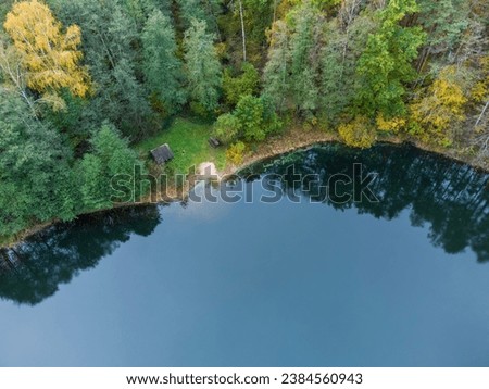 Aerial view of a lake in the forests of Lithuania, wild nature. Rest area, bathing area. Royalty-Free Stock Photo #2384560943