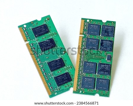 Two green memory ram placed on a white background. Close -up shot of the memory ram.