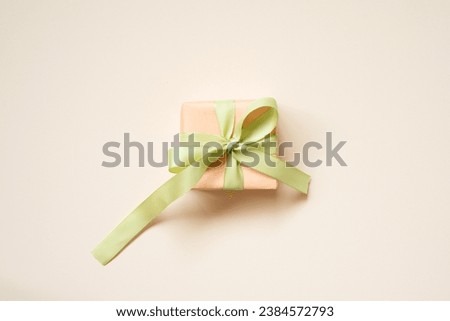 Coral gift box on pink background. top view, copy space