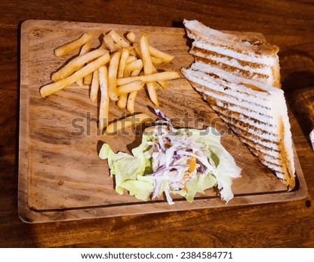 selective focus picture of club chicken sandwich and french fries 