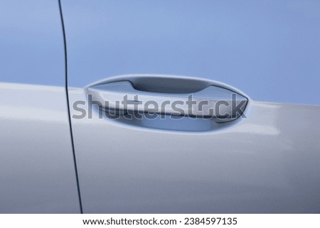 Automatic opening of a car door without a key. Keyless entry car door handle with keyless go touch sensor. Car door handle. Access button. Exterior design of a new electric luxury car. Royalty-Free Stock Photo #2384597135