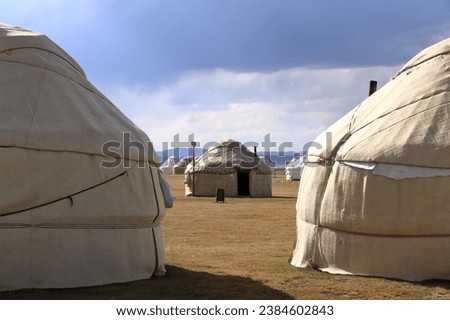 Yurts at Songkol lake Kyrgyzstan in Central Asia Royalty-Free Stock Photo #2384602843