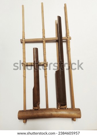 A photo of angklung, a musical instrument from the Sundanese people in Indonesia made of a varying number of bamboo tubes attached to a bamboo frame