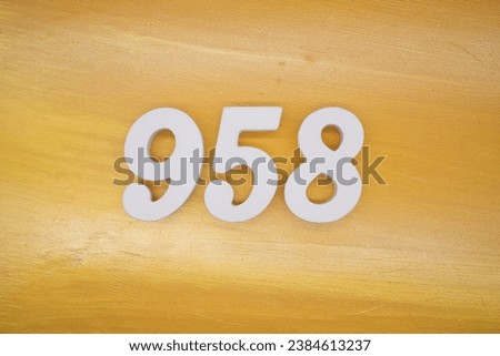 The golden yellow painted wood panel for the background, number 958, is made from white painted wood.