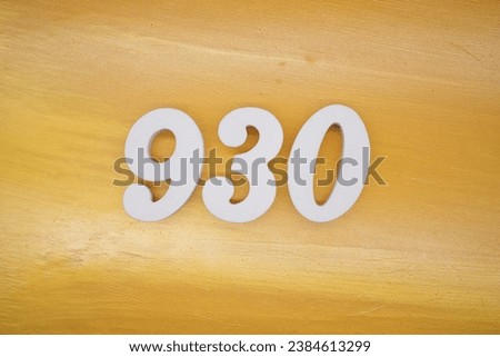 The golden yellow painted wood panel for the background, number 930, is made from white painted wood.