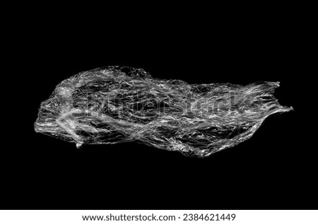 Wrinkled plastic wrap texture on a black background wallpaper. Royalty high-quality free stock photo image of realistic plastic wrap for overlay, copy space and photo effect. Wrinkled plastic surface