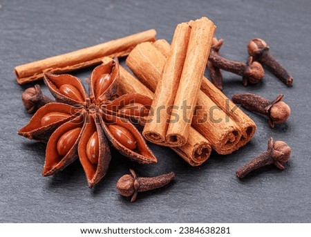 Lots of three spices for mulled wine – star anise, cinnamon and clove, macro. Great background for your projects.