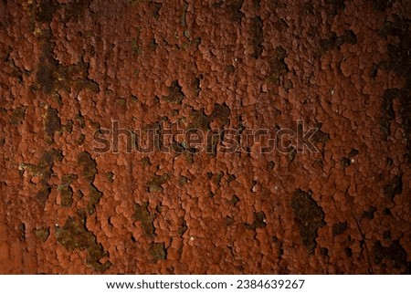 Metal texture with old, rusty paint. View from above.