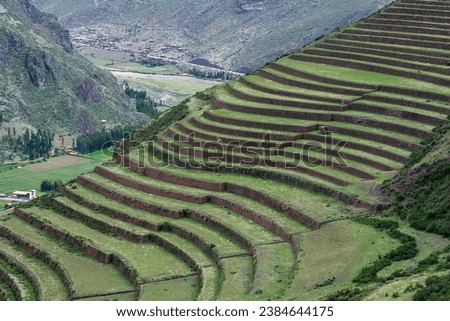The Inca terraces at Pisac are a remarkable set of agricultural terraces located in the Sacred Valley of the Incas in Peru.  Royalty-Free Stock Photo #2384644175