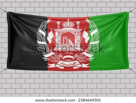 Afghanistan national flag cloth fabric waving on beautiful bricks Background.