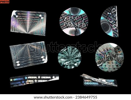 Ripped, crumpled, damaged hologram sticker collection. original, qc passed tamper proof seals isolated on black background. Royalty-Free Stock Photo #2384649755
