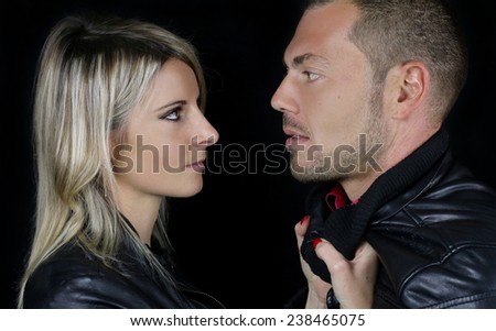 young couple dressed in a black leather 