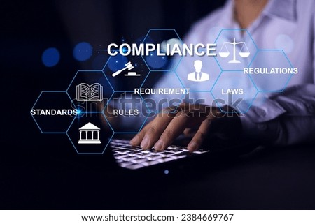 Compliance concept with businessman working with laptop to apply requirement for standard regulation to meet government trade on global business Royalty-Free Stock Photo #2384669767