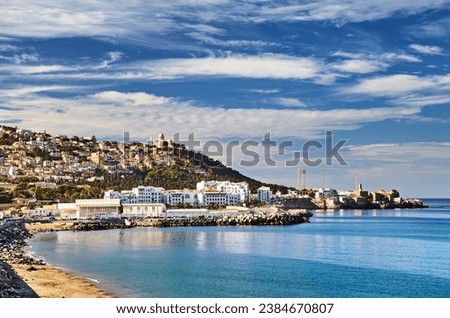 Algiers is the capital and largest city of Algeria, situated on Mediterranean coast of Northern Africa, view of the coast across the bay of Algiers Royalty-Free Stock Photo #2384670807