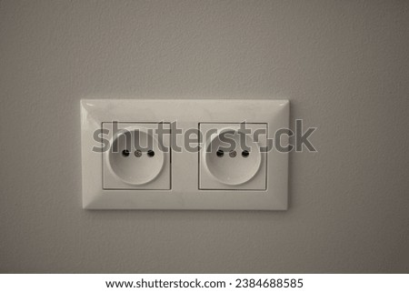 two white electrical outlet in the house Royalty-Free Stock Photo #2384688585