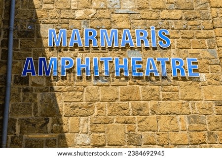Inscription Marmaris Amphitheater in the Turkish city of Marmaris. Background with selective focus and copy space for text