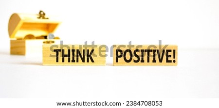 Think positive symbol. Concept words Think positive on beautiful wooden block. Beautiful white table background. Wooden chest coins. Business, motivational think positive thinking concept. Copy space.