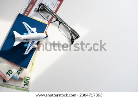 Air tickets, passports, money and toy plane