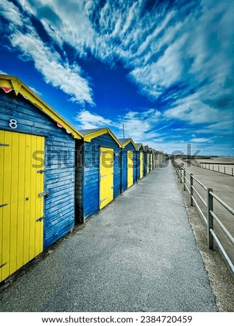 Beach huts on a Coastal walk along the walkway near Margate in Kent UK Royalty-Free Stock Photo #2384720459