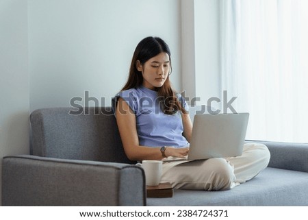 Happy beautiful Asian Woman. Business woman working from home with laptop Financial Home work space concept