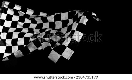 Checkered Racing Flag against Black Background. Studio Shot.