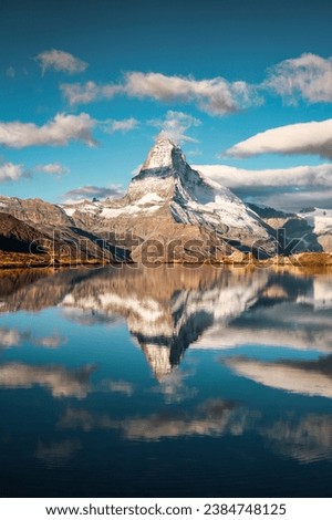 Majestic landscape of Matterhorn mountain reflected on Lake Stellisee in the morning at Zermatt, Switzerland Royalty-Free Stock Photo #2384748125