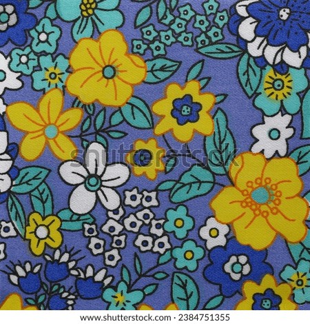 Flower pattern fabric design close up in blue and yellow