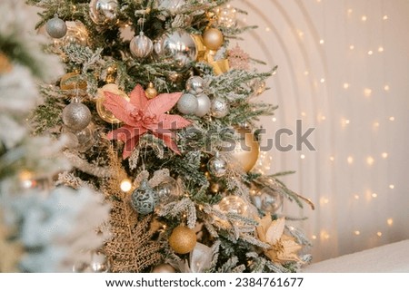Christmas decoration, tree with toys. Interior decoration for the holiday. present. Home comfort
