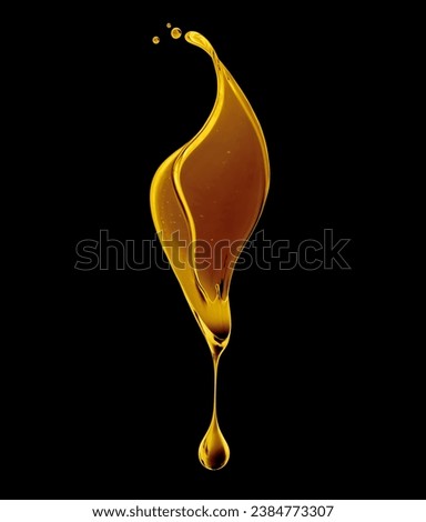 Drop of olive oil or oily cosmetic liquid dripping close up on a black background