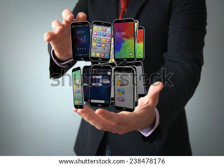 communications technology connection concept: smartphones collection on the hand of a businessman Royalty-Free Stock Photo #238478176
