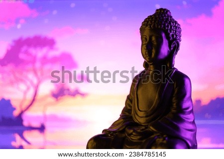 Buddha Purnima and Vesak day concept, Buddha statue with low key light against beautiful and colorful background close up. Meditation Royalty-Free Stock Photo #2384785145