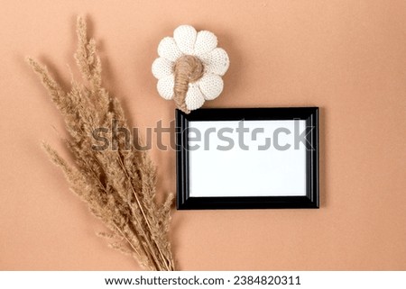 Picture frame mockup with decorative pumpkin on beige background, Thanksgiving, Halloween holiday poster concept.