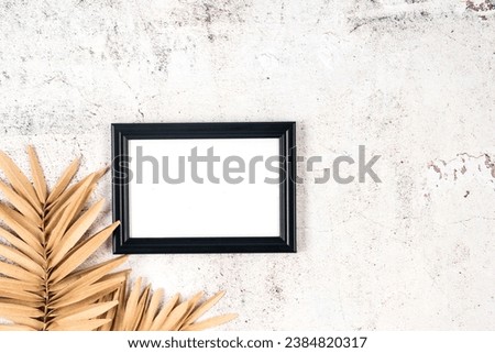 Picture frame mockup with decorative pumpkin on grey concrete background, Thanksgiving, Halloween holiday poster concept.