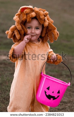 Eating a sucker while trick or treating