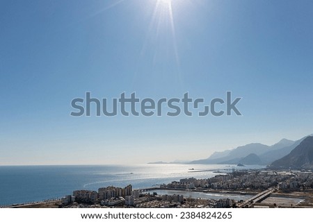 Tourism city Antalya, Mediterranean Sea and Konyaaltı beach with Taurus Mountains in the background. Türkiye Royalty-Free Stock Photo #2384824265