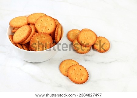 Homemade gluten free chocolate chip and nut cookies on a concrete background, modern bakery concept with dry french sesame cracker. Healthy breakfast with ingredients, top view, selective focus,