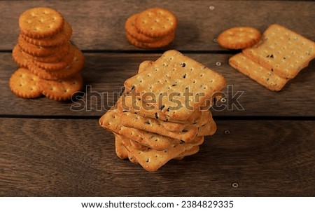 Dry french cracker with sesame seeds on wooden background.Homemade chocolate chip cookies with gluten free nuts,modern bakery concept. Healthy breakfast with ingredients, top view, selective focus,