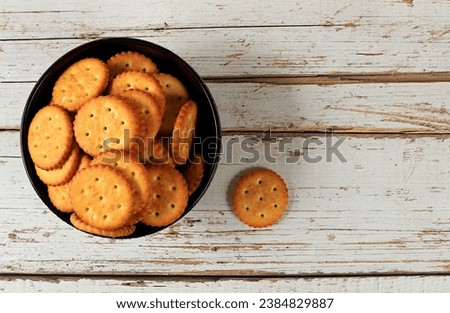 Dry french cracker with sesame seeds on wooden background.Homemade chocolate chip cookies with gluten free nuts,modern bakery concept. Healthy breakfast with ingredients, top view, selective focus,